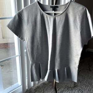 Grey Jersey top with ruffle hem